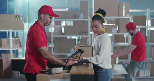 In Post Office Young Afroamerican Woman in Casual Clothes Paying for Order Receiving Delivery Box