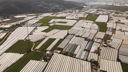 Greenhouses Stretching Across the Rural Landscape From Above