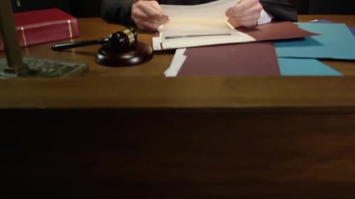 Tilt up to reveal judge in court room HD