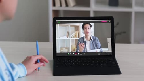 Two People on Video Call on Laptop