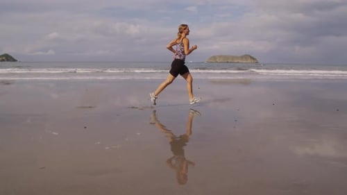 Woman Running on Beach,