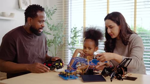 Family Working Together on Robotics Project at Home
