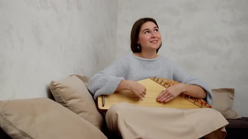 Musician Captivating with Her Skills on a Gusli a Traditional Russian String Instrument A Young