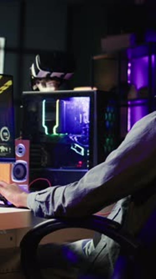 Excited Young Man Playing Video Game at Night