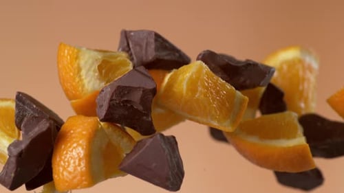 Orange Slices and Chocolate Chunks Floating in Air