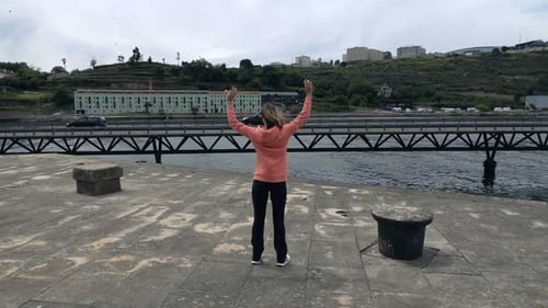 Successful Female Jogger Raising Arms In City, Super Slow Motion 240fps