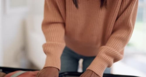 Adult Packing Suitcase and Plane Tickets for Travel