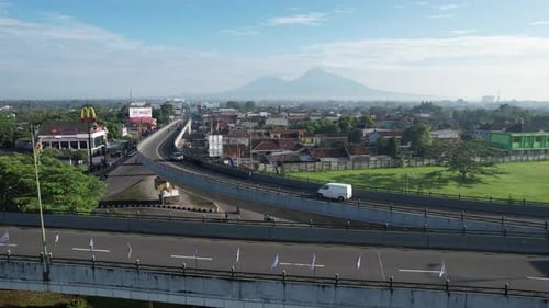 Busy Indonesian City Road with Cars and Traffic