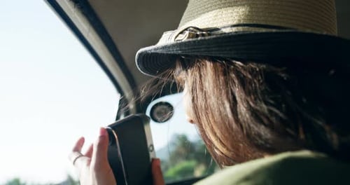 Vintage camera, woman and road trip in care, excited and holiday adventure