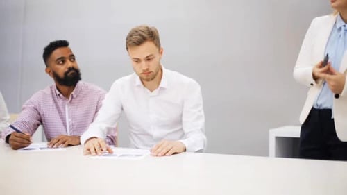 Multiethnic business team brainstorming strategy at office presentation