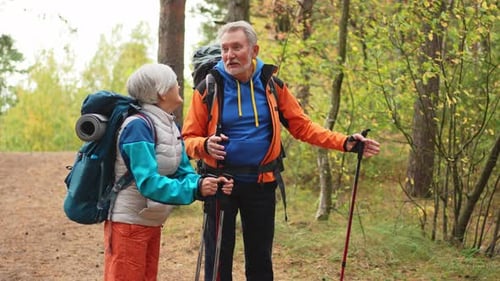 Hiking Tourism Adventure Senior Couple Man Woman Enjoying Outdoor Recreation Hiking in Forest Happy