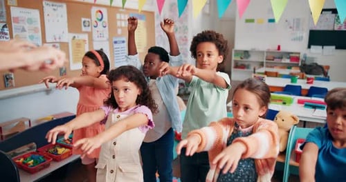 Kids Doing Arm Exercises in the Classroom