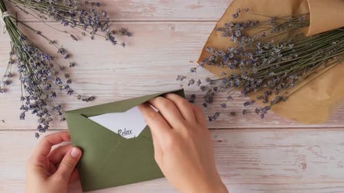 RELAX REFRESH RECHARGE Text on Supportive Message Paper Note Reminder From Green Envelope Flat Lay