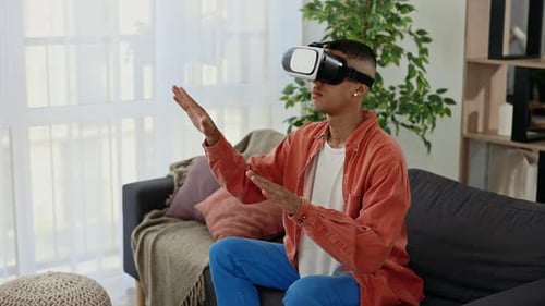 Man Wearing Virtual Reality Headset at Home