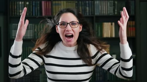 Angry Woman Raises Hands and Shouts Loudly
