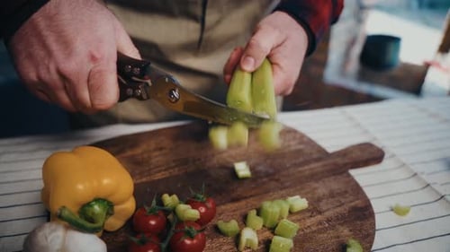 Cutting Celery on a Wood Cutting Board