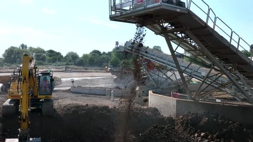 Conveyor System Sorting Material at Industrial Site