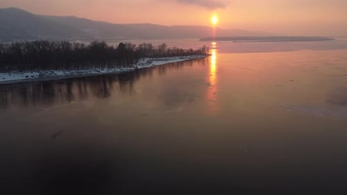 View of the Hills By the River at Sunset