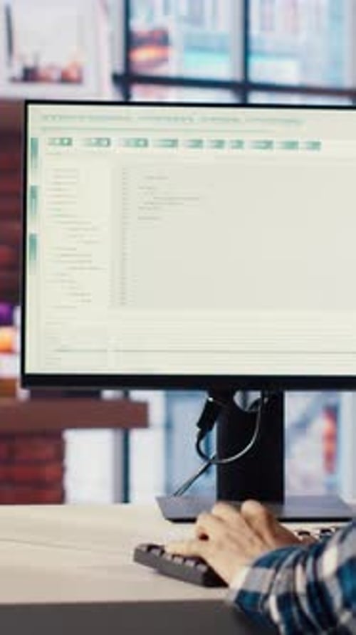 Man in Home Office Fixing Errors in Application Using Chroma Key Device and PC