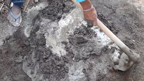 Mixing Cement with Spade Outdoors