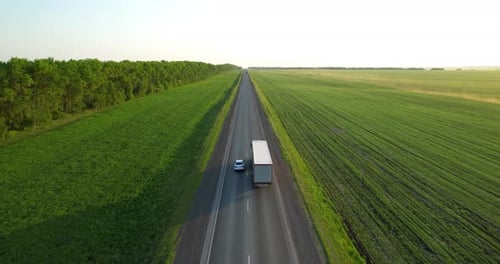 Trucks with a Semitrailer Drive Along the Highway Aerial View