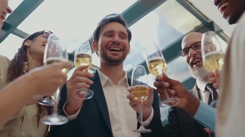 Colleagues Clink Champagne Glasses in Corporate Celebration