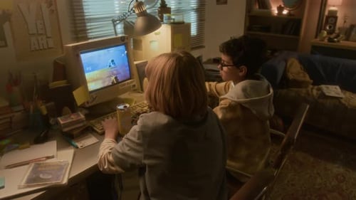 Children Playing Retro Video Game at Home