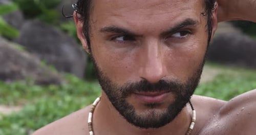 Closeup Portrait of a Relaxed Attractive Charming Brunet Hispanic Man Touching Hair Fixing Hairstyle