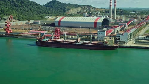 Aerial view of ship docked waiting to be transported at the pier