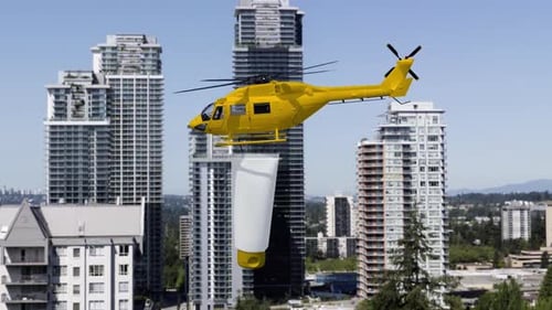 Yellow Helicopter Transporting Product Tube Over Cityscape