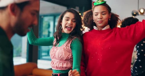 Cheerful Friends Dancing at a Holiday Party