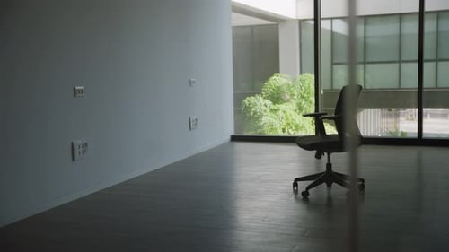Empty modern office room with one chair and glass windows before moving in or business going