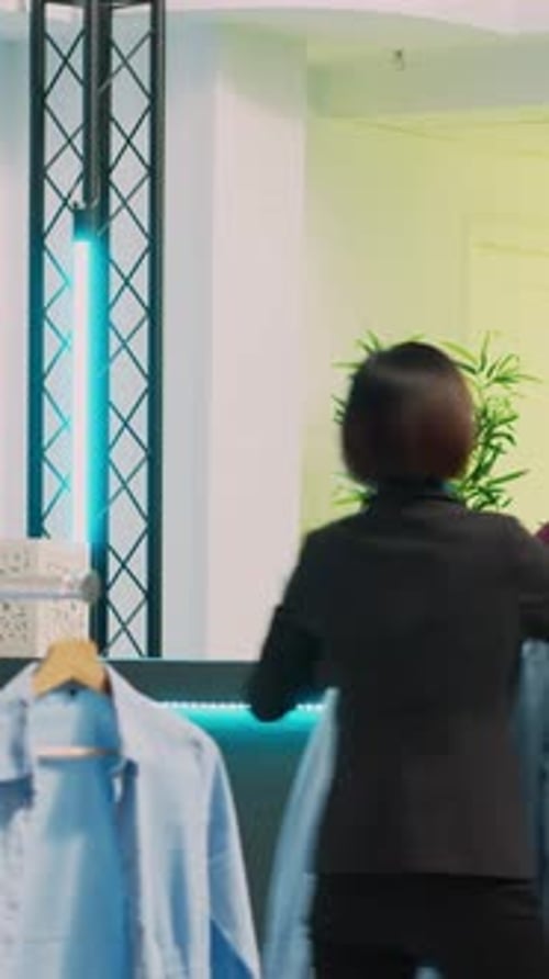 Vertical Video Asian Person Buying Fashion Collection in Boutique Shop