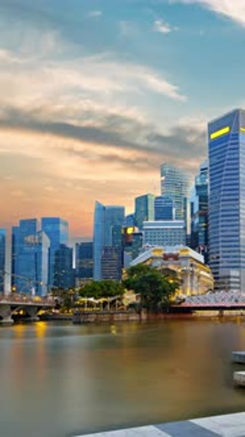 Singapore Central Business District seen from Marina bay transform from dusk to night.