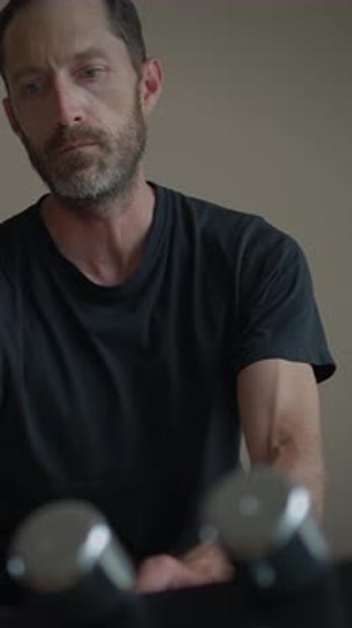 A Man Engaged in Thoughtful Reflection Within a Minimalist and Serene Setting Environment
