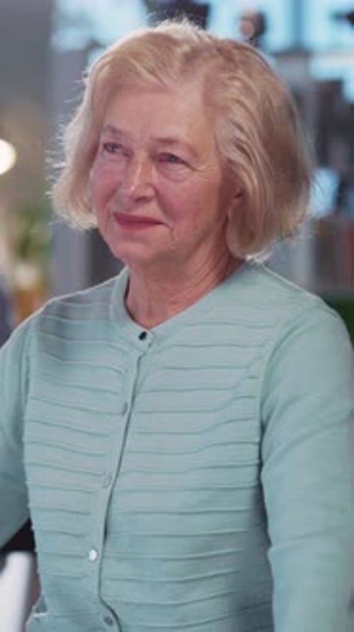 Indoor Portrait of Elegant Beautiful Mature Lady Pensioner Smiling to Camera Rejoicing Company