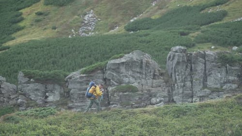 Solo Hiker Trekking Mountainous Path with Backpack