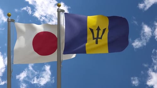 Japan and Barbados Flags Waving Under Blue Sky