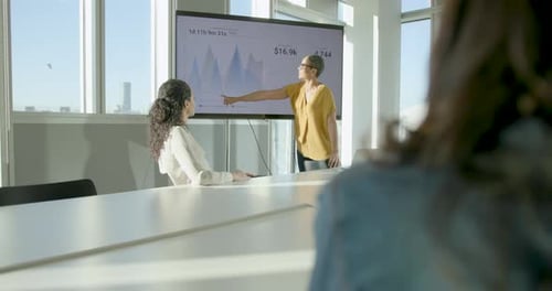 Mature Businesswoman Presenting in Office Boardroom