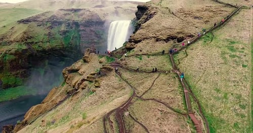 Seljalandsfoss Waterfall in Iceland, a bottom to top view with camera gimbal rotation view the climb