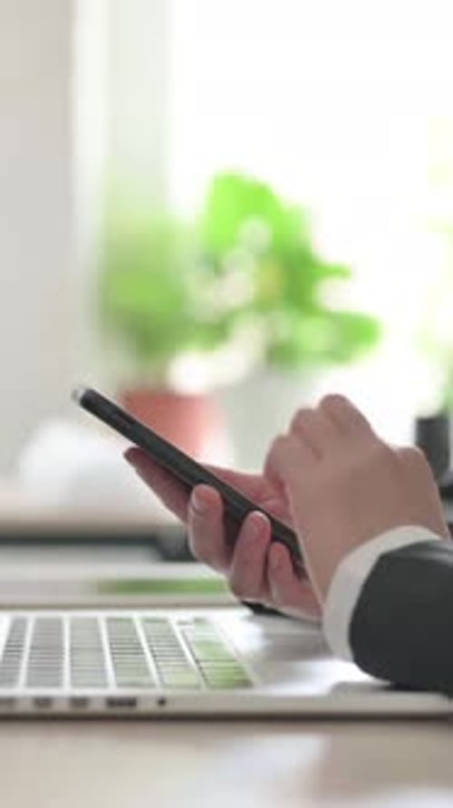 Side View of Young Businesswoman Using Smartphone, Vertical Video