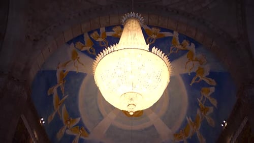 European catholic church interior chandelier.
Religious Catholic cathedral ceiling decoration with