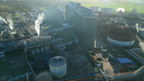 Aerial view of industrial site with tanks, United Kingdom.