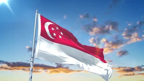Waving Singapore Flag Against Bright Blue Sky