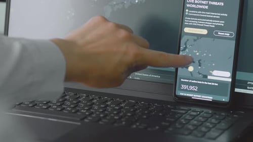 Finger Points to Cyber Threats Map on Phone