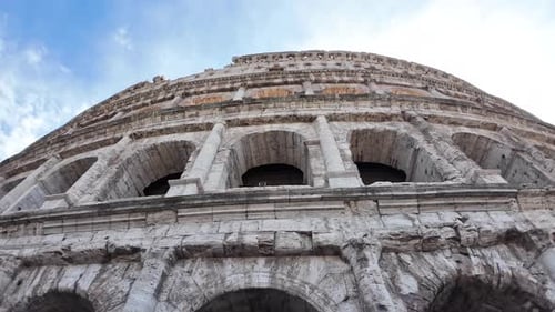 Colosseum Exterior Ruins Against Blue Sky in Rome