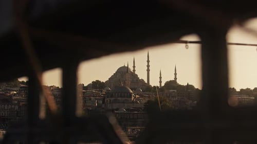 Golden Sunset Over Istanbul Skyline from a Moving Window