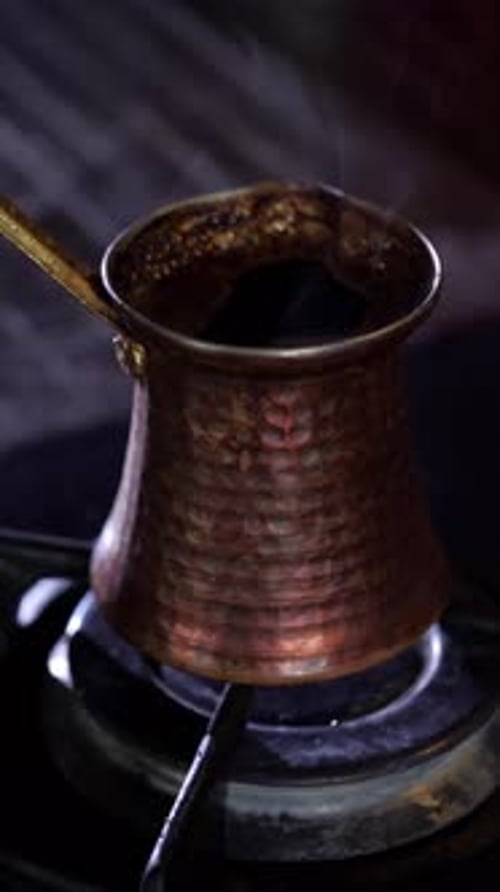 Turkish Coffee Brewing in a Cezve on a Gas Stove
