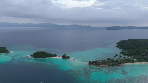 Blue and turquoise water with hundreds of gray and green unique hills in Coron, Philippines
