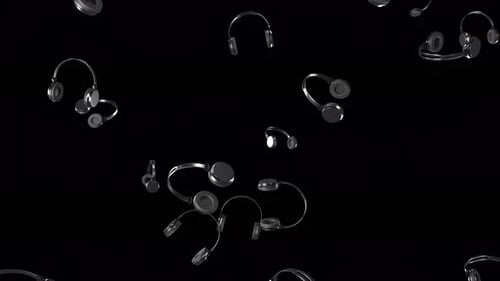 Multiple falling headphones on a transparent background with alpha channel.